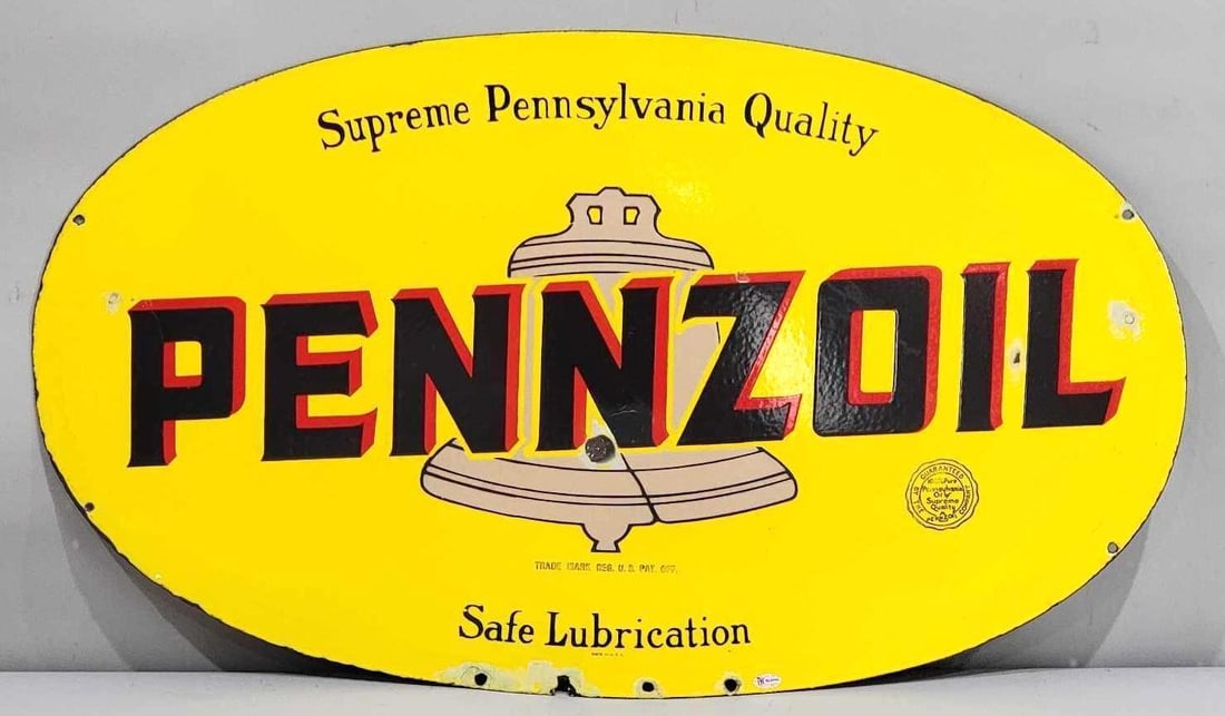 Pennzoil Safe Lubrication w/Tan Bell Porcelain Sign (TAC): rated 8.25, 18"x31", the DSP oval sign has good color and gloss, has touched up chips in the field and around the perimeter, marked Made in U.S.A. Rarity 5. TAC #032417