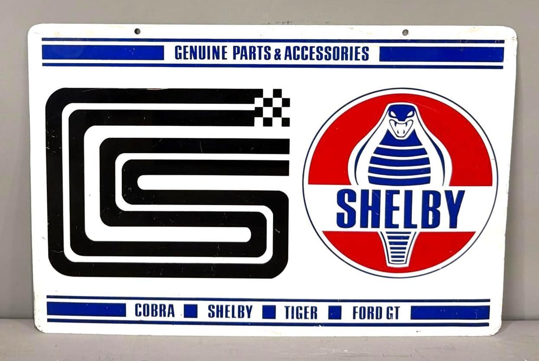 Rare 1970's Shelby Genuine Parts & Accessories Metal Sign: rated 8.75, 12"x18", the DST sign has good color and shine, has light wear and fine scratches. This sign was from a California based company that was one of the only Authorized Distributors by Fo