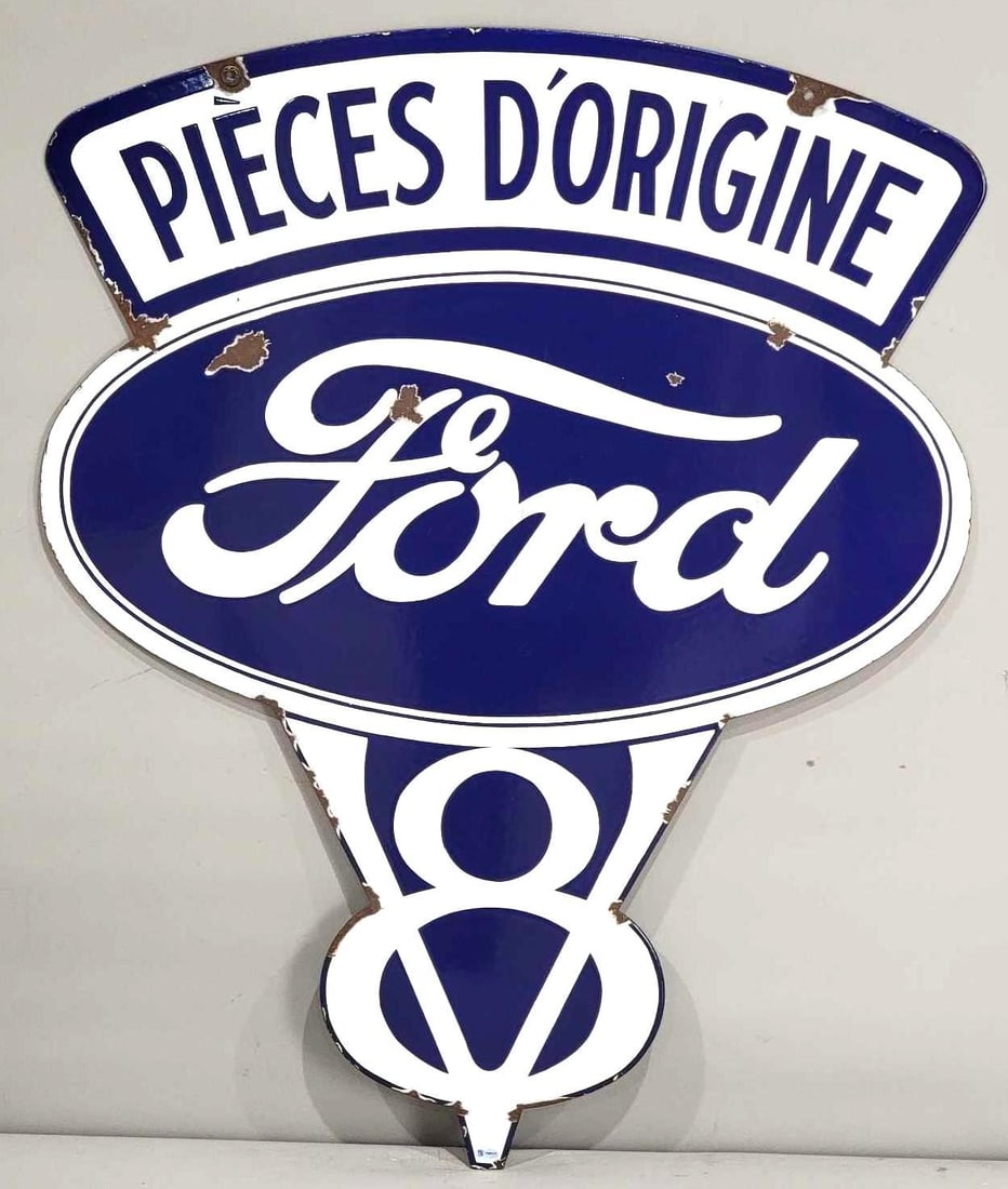 Ford V-8 Porcelain Sign (TAC): rated 8.5 & 8.25, 35.25"x28", the DSP die-cut sign has excellent color and gloss, display has chips in the field, reverse has more chips and chips around the perimeter. Rarity 7. TAC #036621