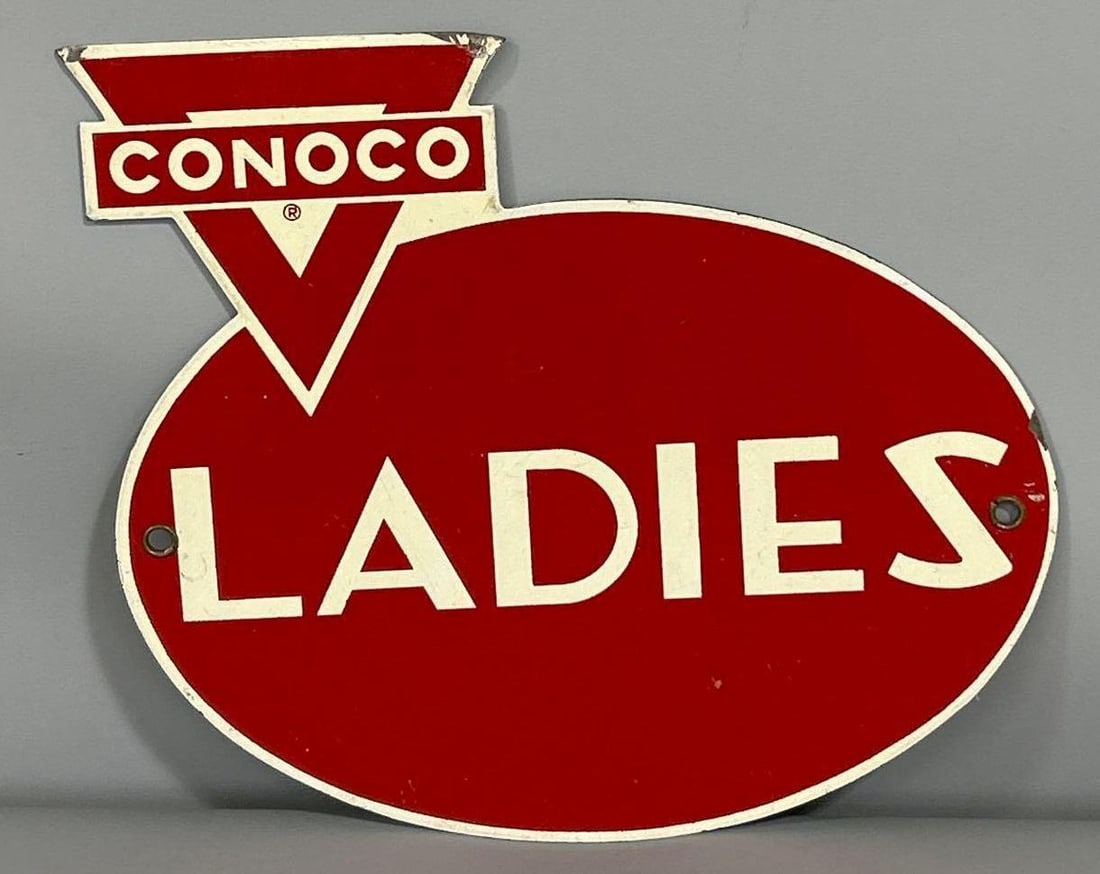 Conoco Ladies Rest Room Metal Sign (TAC): rated 8.9, 9.25'x10.5", the SST die-cut sign has good color and shine. Sign has damaged top corner. Rarity 3. TAC #061457