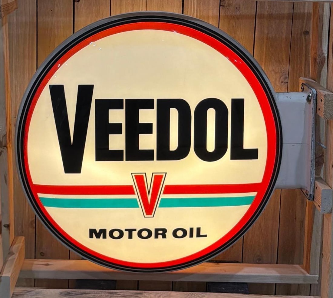 Veedol Motor Oil Lighted Service Station Sign (TAC): rated 9, 37"x41", the 2-molded plastic insert are excellent condition, mounted in a metal flange mounted light box, Lights up nicely. Rarity 7. Extremely hard to find, especially a complete example, w