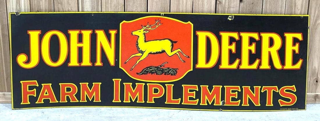 John Deere w/4-Leg Logo Farm Implements Porcelain Sign (TAC): rated 8, 24"x72". This DSP sign has good color and some gloss. Sign has wear and scratches on both sides. Rarity 7. TAC #061690