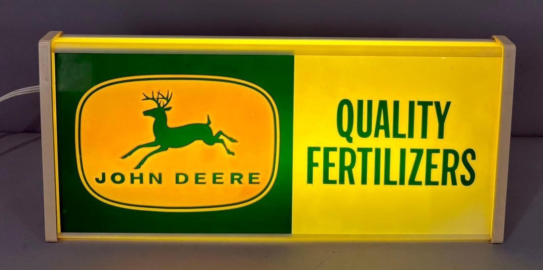 John Deere 4-Legged Logo "Quality Fertilizers Lighted Sign: rated 9, 9"x20"x4", the plastic lighted sign is in very good condition, lights up nicely. 