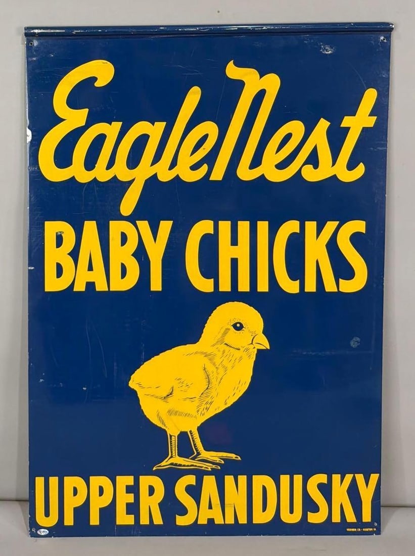 Eagle Nest Baby Chicks Upper Sandusky w/Image Metal Sign (TAC): rated 8.25/8, 34.5"x24", the DST sign with rolled top edge, has good color and shine, has wear and marks, marked Vernon. TAC #036922