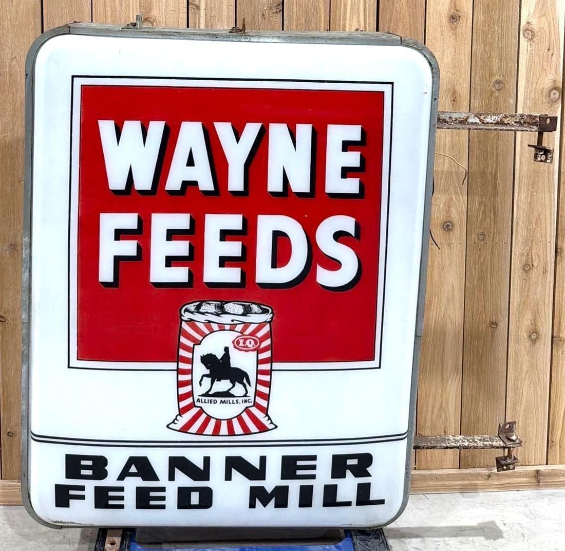 Wayne Feeds w/Sack Logo Plastic Lighted Sign (TAC): rated 9 & 7, 52"x40", the 2-molded plastic inserts both have good color, display is in good condition, reverse is broken at the lower right-hand corner, wires are cut. TAC #063796
