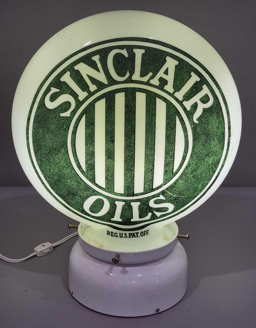 Sinclair Oils w/Jail-Bar Logo OPE Milk Glass Globe (TAC): rated 7, 15"T, the OPE (one-piece etched) milk glass globe body, has good color, has long crack in one side. We will no guarantee this item if it is shipped. TAC #025243
