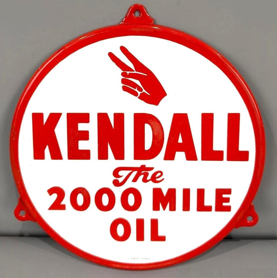Kendall The 2000 Mile Oil Porcelain Sign (TAC): rated 9, 9"D., the SSP rolled edge sign has excellent color and gloss, field is clean, has touched up chip at nine o'clock, marked Longcat Bussum. TAC #063645