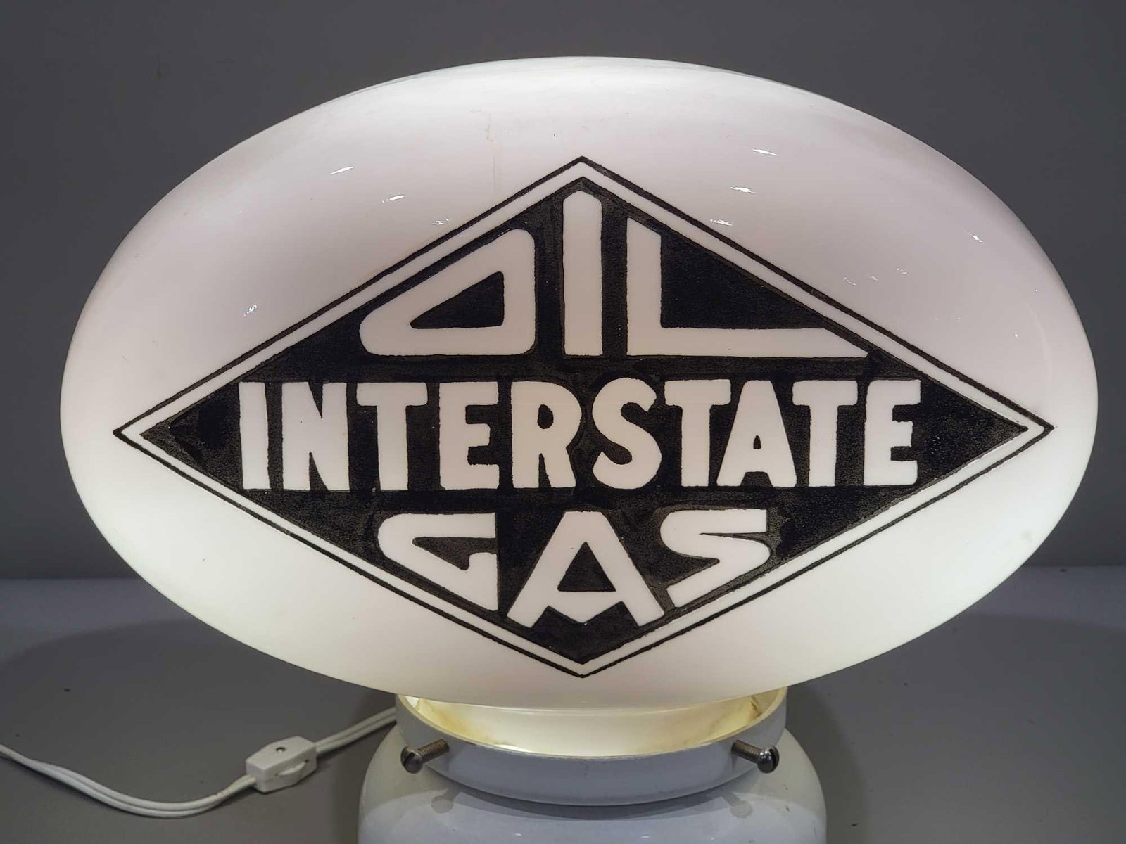 Interstate Oil Gas OPE Oval Milk Glass Globe (TAC): rated 8.5, the OPE oval milk glass globe, has large chips on the base, see photos. TAC #025308