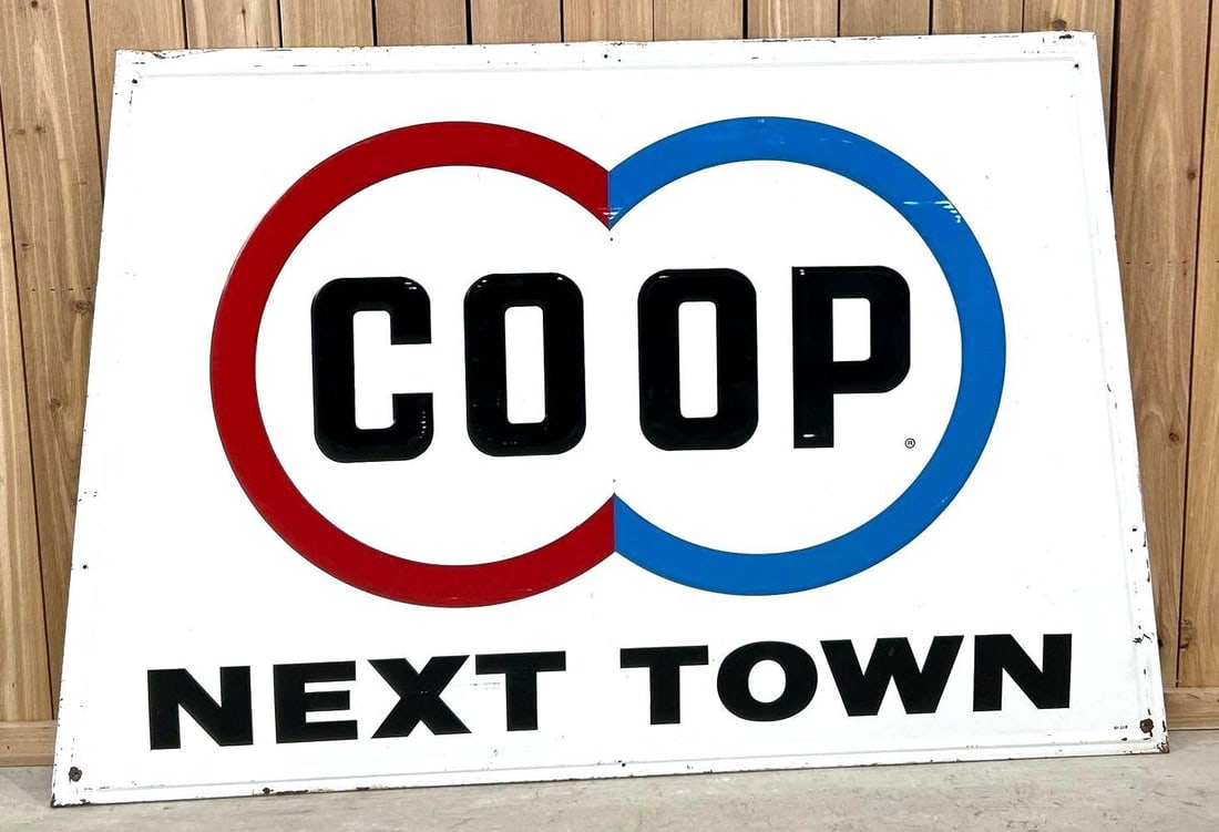 COOP Logo "Next Town" Metal Sign (TAC): rated 8.5"x46"x70", the SST embossed wood backed sign has good color and shine, has wear. Rarity 5. TAC #062996