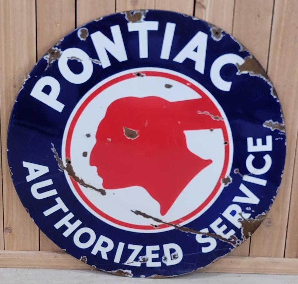 Pontiac Authorized Service w/Chopped Feather Logo Porcelain Sign (TAC): rated 7, 42"D., the SSP sign has good color and gloss, has chips and wear in the field, has four holes drilled in the field, has a cease. Rarity 4. TAC #036609
