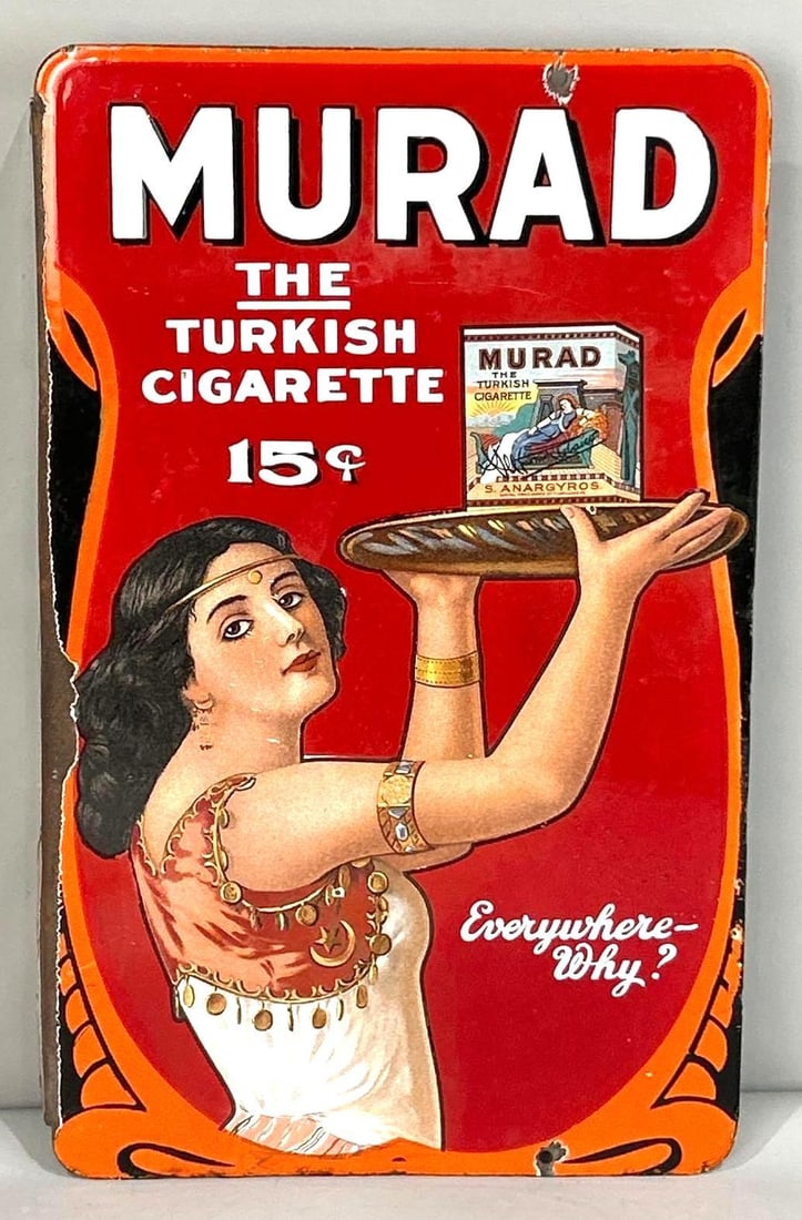 Murad "The Turkish Cigarette" Lithograph On Porcelain Flange Sign: (Rated 8.0, 7.75). 12" x 20". This DSP flange sign has good color and gloss throughout both sides. Display shows light surface abrasions on the graphic as well as porcelain loss on the outer edges and