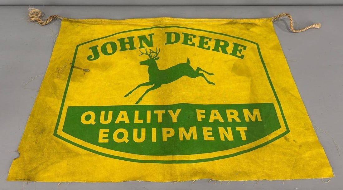 John Deere w/4-Leg Logo QFE Logo Canvas Banner: rated 7.5, 19.5"x25.5", the canvas banner has good color and staining and soiling.