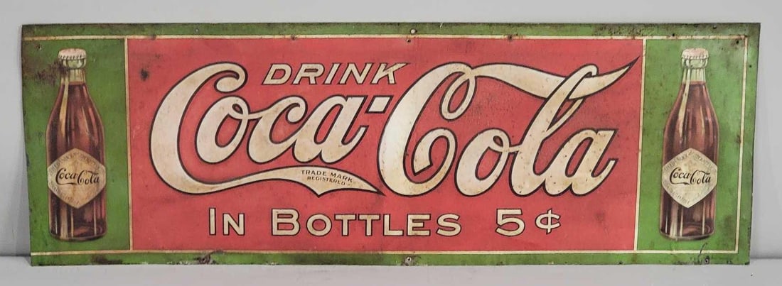 Early Drink Coca-Cola in Bottles w/Paper Label Metal Sign (TAC): rated 6.75, 11.75"x34.5", trimmed, the SST sign has rust staining and wear, left-hand edge has been trimmed, marked American Art Works. Rarity 7. TAC #063344