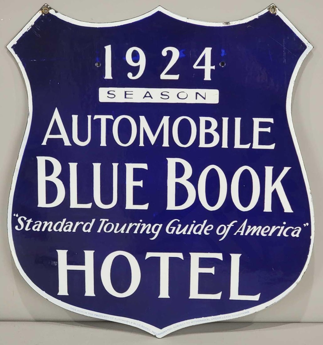 1924 Automobile Blue Book Hotel Porcelain Sign (TAC): rated 9.25, 21"x19.25", the DSP shield-shaped sign has excellent color and gloss, fields are clean, has tiny chips along the top edge, marked. Also comes with 1925 SSP sign to bolt over 1924 for the
