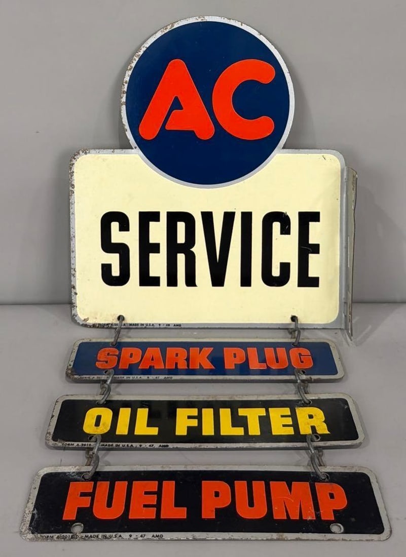 AC Service Metal Flange Sign w/Trailers (TAC): rated 8.5, 12"x10.5" overall 21"x10.5", the diecut metal flange sign has good color and shine, has minor wear in the field, wear around the perimeter, overs have wear, marked AMD, dated 1948. Rarity 4