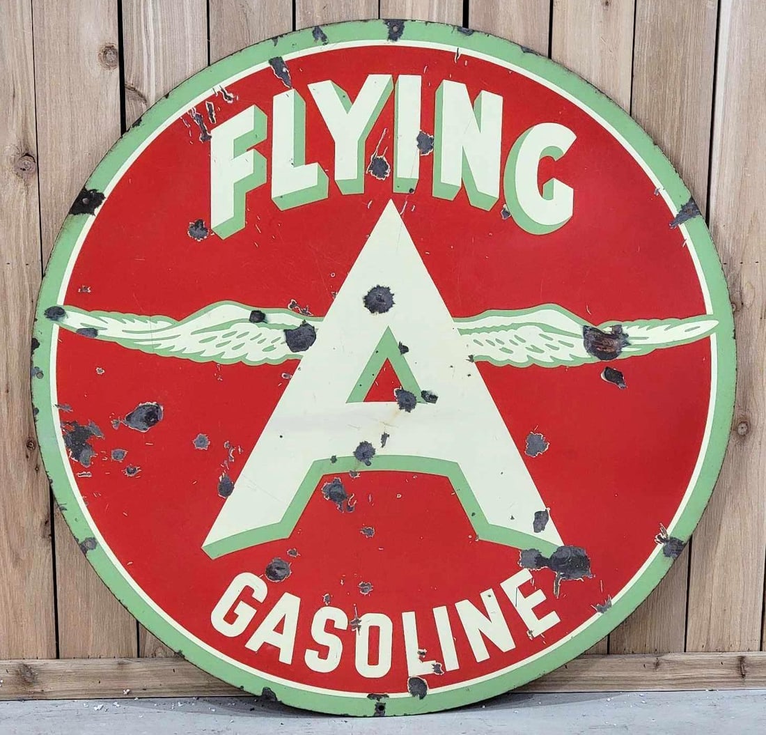 Flying A Gasoline w/Chicken Wing Logo Porcelain Sign (TAC): rated 7, 47.5"D., the DSP sign has good color and gloss, both sides have large chips, wear and fine scratches, reverse has more rust staining. Rarity 6. TAC #063250