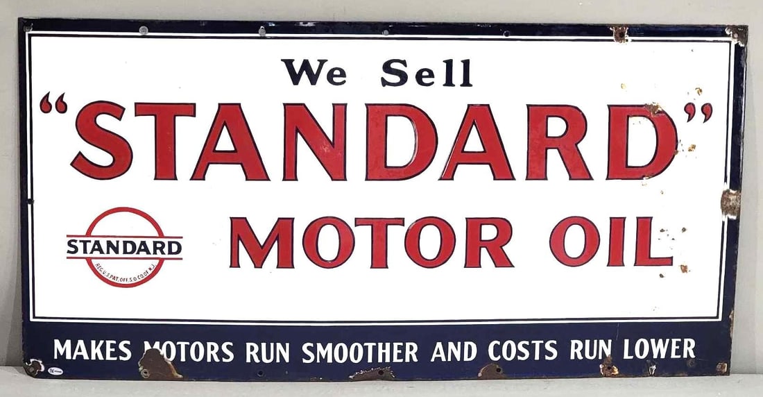 We Sell "Standard" Motor Oil w/Logo Porcelain Sign (TAC): rated 8.25, 18"x36", the SSP sign has very good color and gloss, field is clean, has chips in the right-hand field, chips at mounting holes. Rarity 4. TAC #032448
