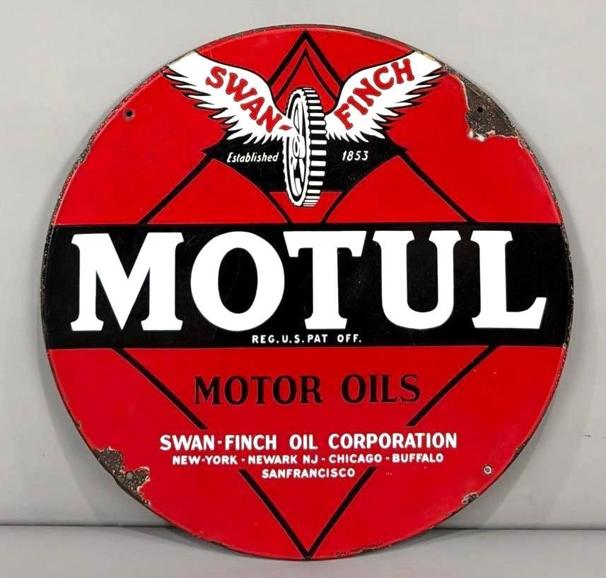Motul Motor Oils Swan-Finch Oil Corp w/Logo Porcelain Sign (TAC): rated 8.5, 27.5"D., the SSP rolled edge sign has good color and gloss, has wear in the field and large chips at two mounting holes, marked. TAC #063628