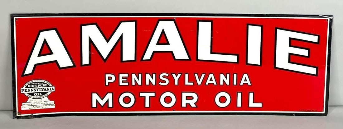 Amalie Motor Oil Single-Sided Tin Sign: (Rated 8.5). 12" x 36". This SST sign has good color and gloss throughout. Display shows surface scratches and staining throughout. Outer edge has staining and paint loss. Marked, "A-M sign co." Rarit