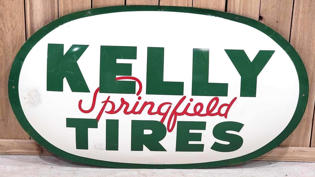 Kelly Springfield Tires Metal Sign (TAC): rated 8.5, 29"x51", the SST oval embossed sign has very good color and shine, has light wear and a few fine scratches, marked A-M, dated 1956. Rarity 3. TAC #063348