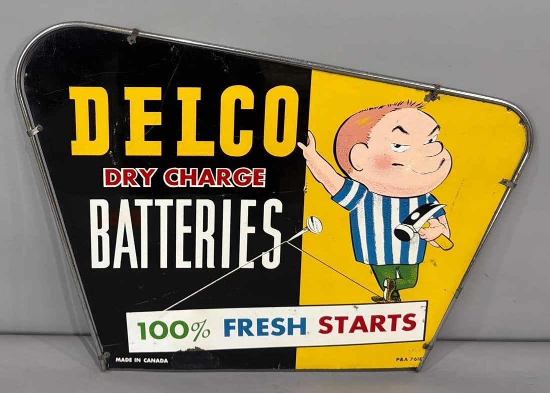 Delco Dry Charge Batteries w/Logo Metal Rack Topper Sign (TAC): rated 8, 19"x25", the SST diecut sign has good color and shine, has wear and fine scratches, touched up chip at bottom edge. Rarity 8. TAC #063754