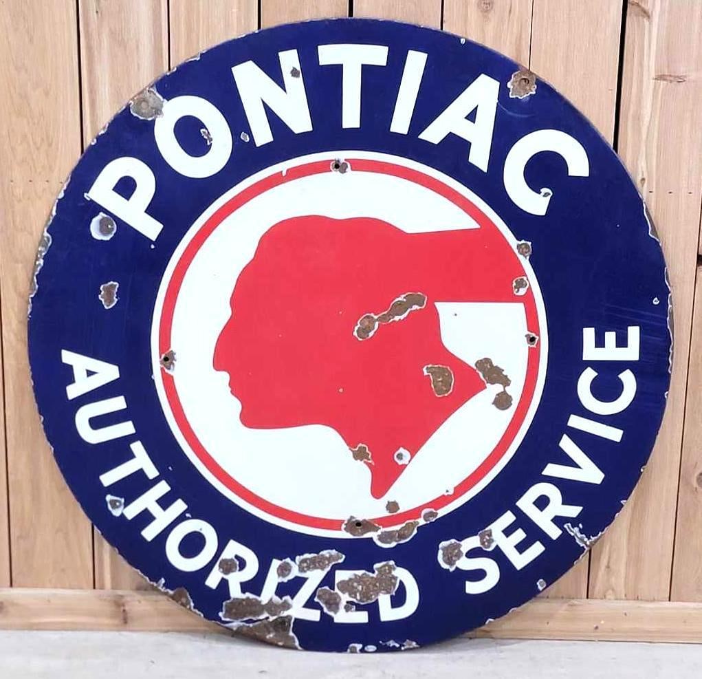 Pontiac Authorized Service w/Chopped Feather Logo Porcelain Sign (TAC): rated 7.5, 42"D., the SSP sign has good color and gloss, has chips and wear in the field, has four holes drilled in the field. Rarity 4. TAC #036608