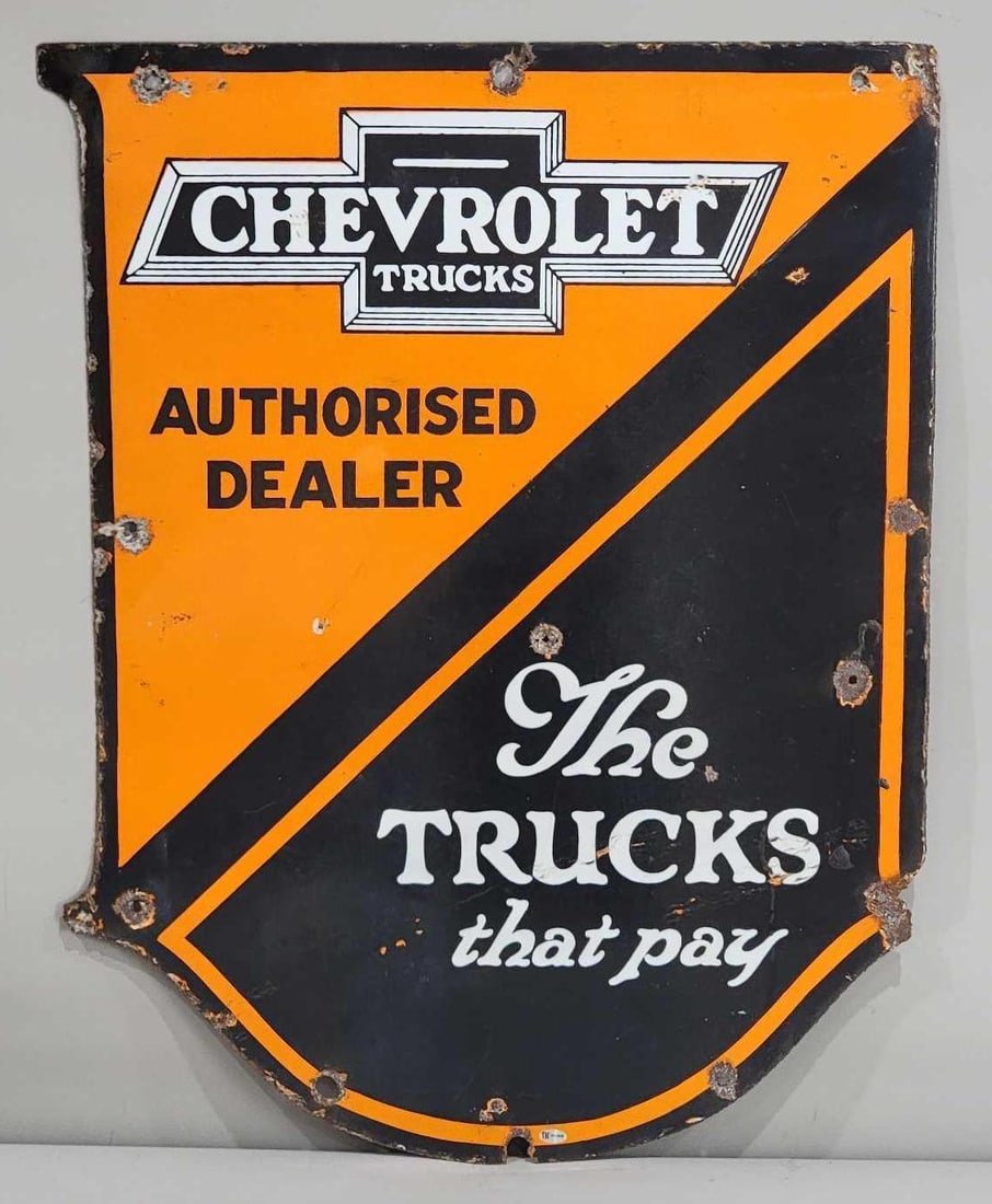 Chevrolet Trucks Authorised Dealer Porcelain Sign (TAC): rated 7, 30"x22", the DSP die-cut sign has good color and some gloss, has extra holes in the field and around the perimeter, wings on right-hand side are missing. Rarity 5. TAC #032426