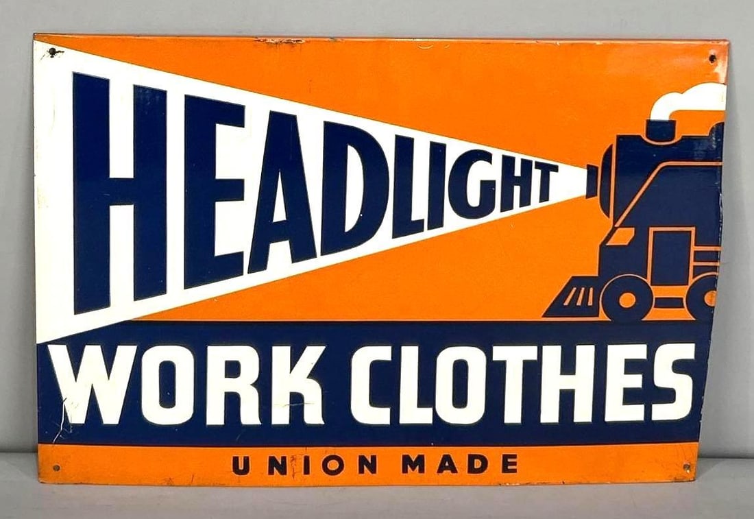 Headlight Work Clothes Tin Sign W/ Locomotive Graphic: (Rated 8.75). 9.25" x 13.25". This SST sign has good color and gloss with moderate scratches throughout the inner and outer fields. Outer edge also shows light wear. Marked, "Donaldson Art Sign C