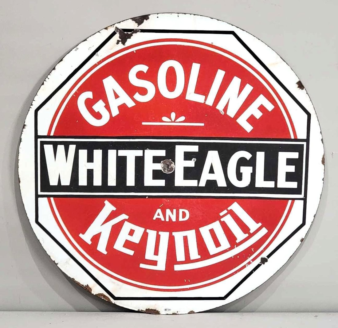White Eagle Gasoline & Keynoil Porcelain Sign (TAC): rated 7.75, 29.75"D., the DSP sign has good color and some gloss, has chips, wear and hole in the field, chips around the perimeter. Rarity 6. TAC #036630