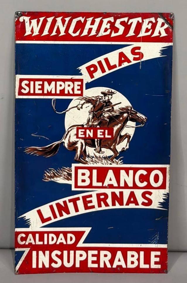 Winchester (Spanish Battery) w/Logo Metal Sign (TAC): rated 7.25, 24"x14", the SST sign has good color and some shine, has wear and scratches, cease at the top right-hand corner. Rarity 8. TAC #046423