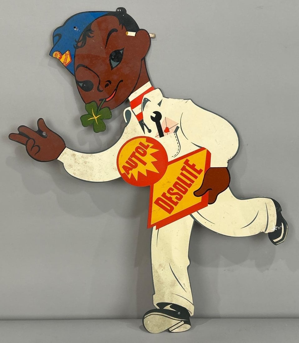 Autol Desolite Die-Cut Tin Sign W/ African American Attendant: Rated 8.5. 9" x 15". This SST sign has good color with minor surface staining and paint loss on the hanging holes. Rarity 3. TAC # 061894.