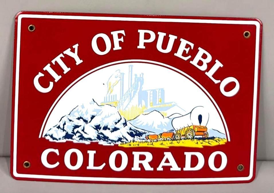 City of Pueblo Colorado w/Image Porcelain Truck Door Sign (TAC): rated 9c, 7.5"x11", the SSP sign has excellent color and gloss, has a flea bite chip in the field. Rarity 5. TAC #064444