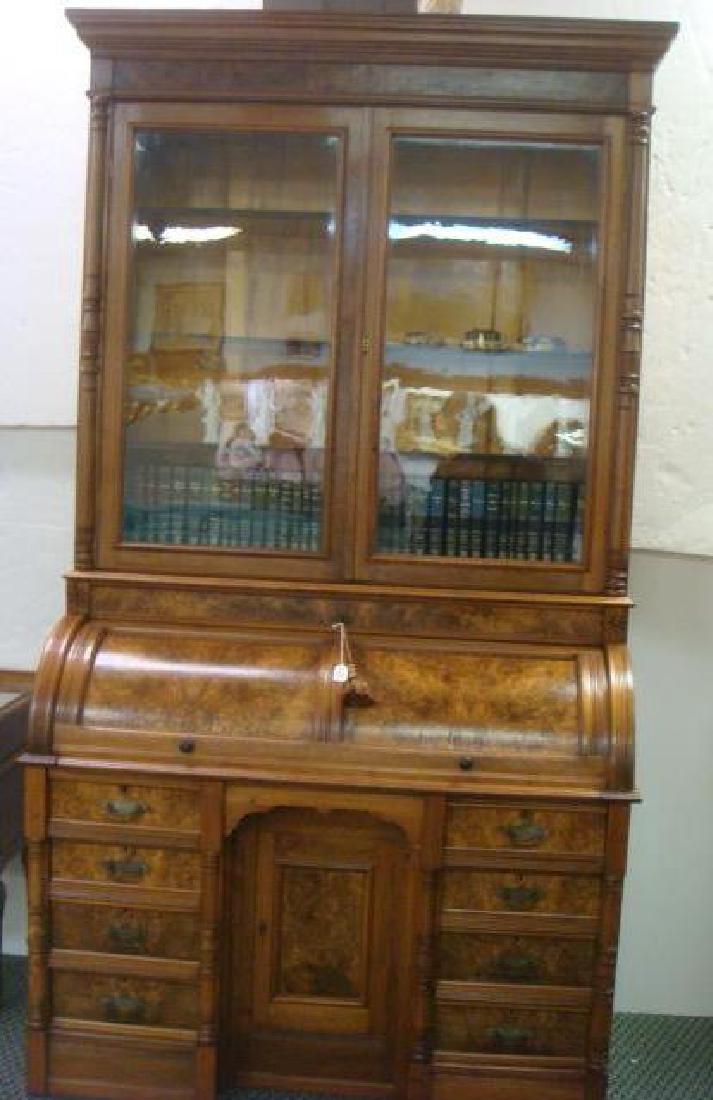 American 19th C. 2 Piece Walnut Cylinder Desk:: American 19th C. 2 Piece Walnut Cylinder Desk: With Bookcase and Burl Panels. Flat Molded Cornice Over Double Glazed Door Book Case with 3 Interior Shelves. Side 1/2 Round Columns. Cylinder Covered De