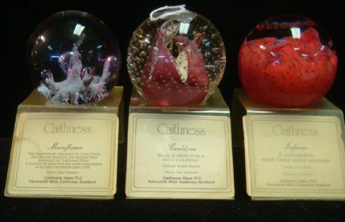 Three CAITHNESS Glass Paperweights with Stands:: Three CAITHNESS Glass Paperweights with Stands: "Cauldron" has Magical Swirls from a Witches Cauldron with Controlled Bubbles. By Innes Burns. "Inferno", a Conflagration which Dante would Recognize. "