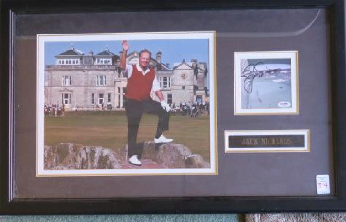 JACK Nicklaus AUTOGRAPH and St Andrews Picture:: JACK Nicklaus AUTOGRAPH and St Andrews Picture: Autograph with PSA DNA Authenticity with Picture of Jack at St Andrews for his Final British Open in 2005. Famed and Matted to 18" x 29". (100-200)