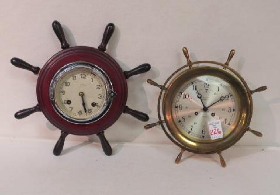 Two German Nautical Ships Wheel Wall Clocks:: Two German Nautical Ships Wheel Wall Clocks: Brass Salem Ships Bell Clock with Silent and Strike Mode. 10 1/2"D. Wood Case with Silver Metal Clock Face has Fast and Slow Switch. 12 1/2"D. Four Jewels.