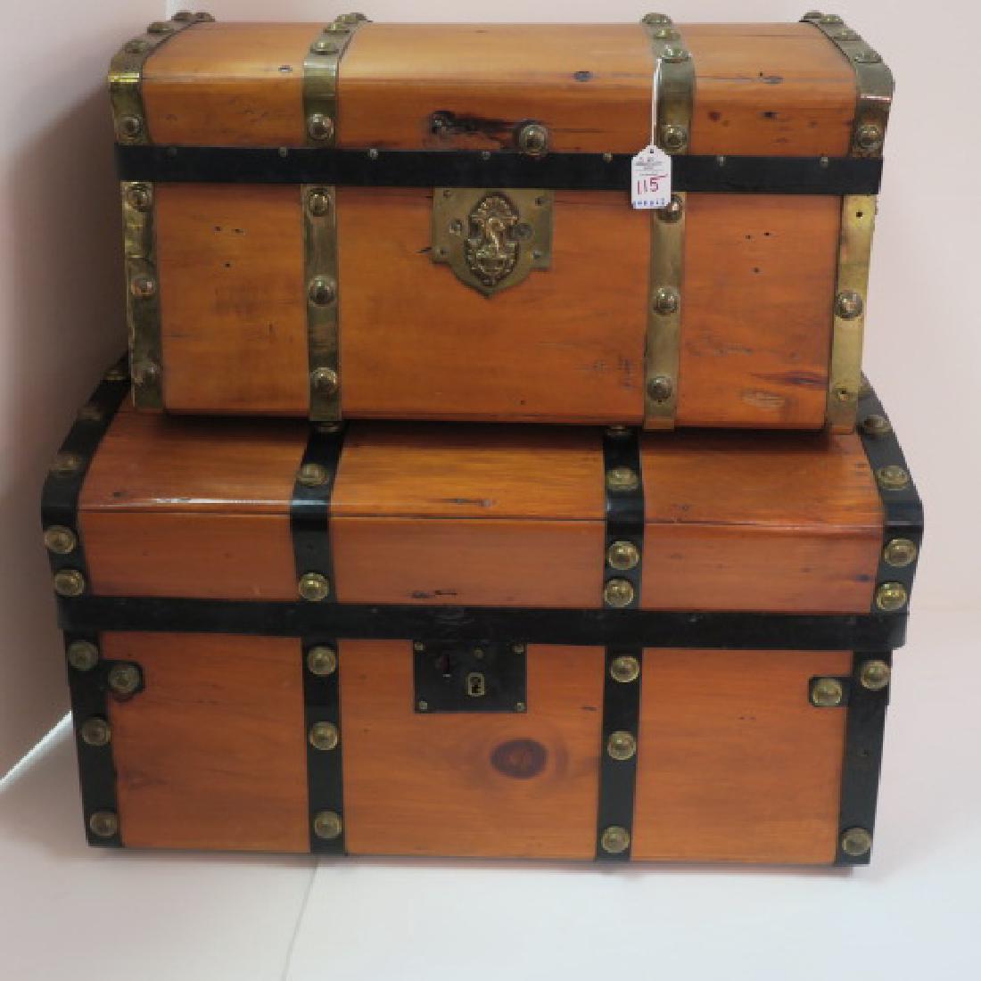 Two Vintage Century Reinforced Banded Box Trunks:: Two Vintage Century Reinforced Banded Box Trunks: Oak Staves, Replaced Leather Handles, Metal Corner Hardware and Cladding. Paper Lined Interior(stained). Largest measures 27"W X 15" T X 15" D. Other