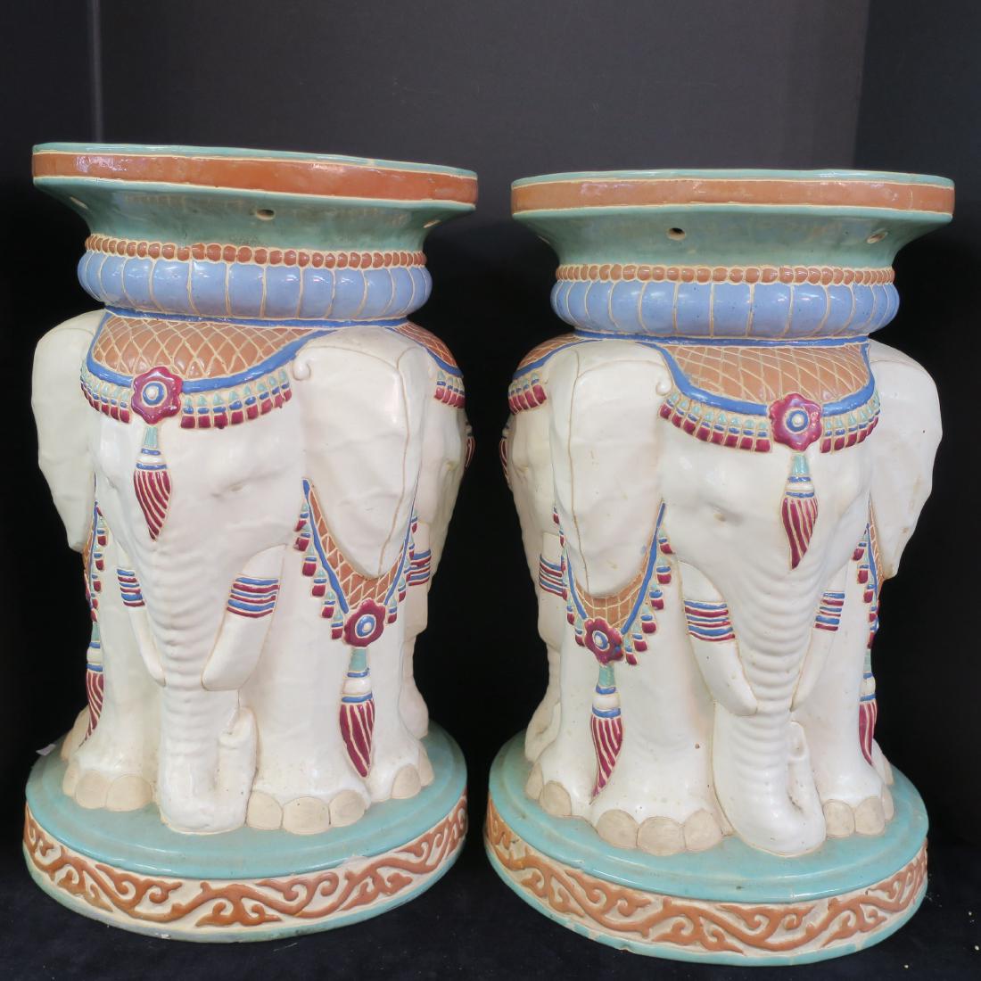Pair of Unusual Round Seat Elephant Garden Stools:: Pair of Unusual Round Seat Elephant Garden Stools: Three Elephants in Ceremonial Garb with Caparison Headdress. Ceramic Seats, Round Foot and Top. 19"T X 11"D. These from Vietnam, 1970's, called "Buff