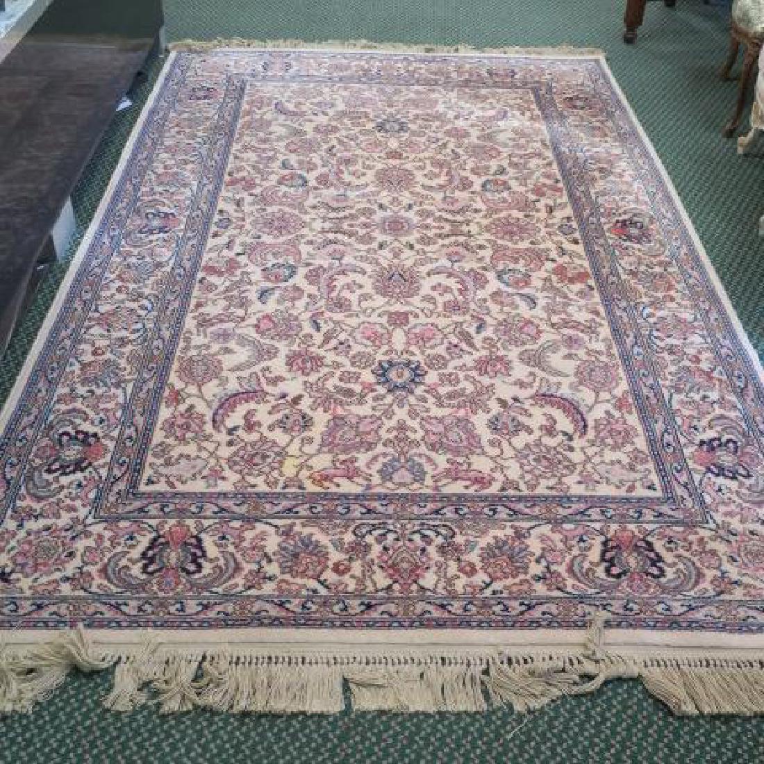 Tabriz Pattern KARASTAN Wool Pile Rug #738:: Tabriz Pattern KARASTAN Wool Pile Rug #738: Measures 5'9" X 9'. Three Banded Border with Busy Field of Scattered Flower Heads and Leaves on Cream Ground. Hand Knotted Fringe. (400-600)