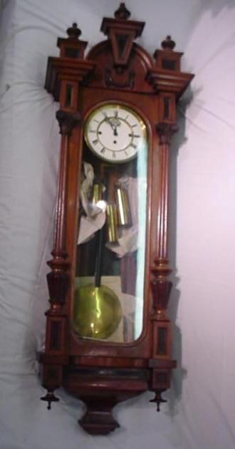 Walnut Austrian Grande Sonnerie Regulator Clock: 637a. Walunt Case Austrian Grande Sonnerie Regulator Wall Clock: 49" x 16 3/4" x 9 1/2", Made by Brothers Reisch Ebebsee, Austrian. Porcelain Face with Roman Numerals. Burl Insets in Panels, Three Fin