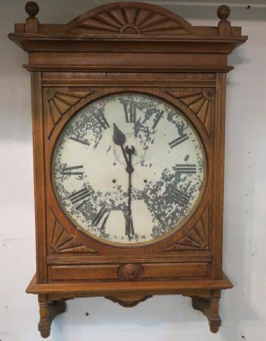 Large SETH THOMAS Oak Case Train Station Clock:: Large SETH THOMAS Oak Case Train Station Clock: Oak Veneered Case is 38"T, 25 1/4"W, 8"D. Ball Finials. Painted Tin Face with Flaking, Age Wear. Key Wind (With Key). Face is 17 1/2"D. (-)