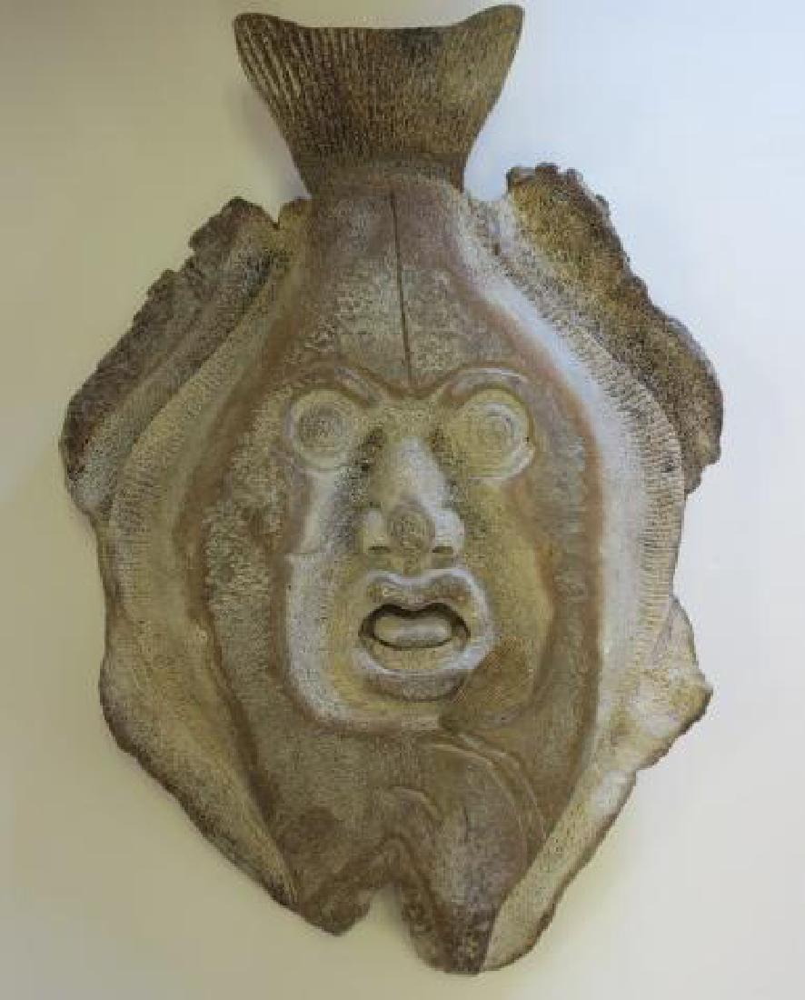 Carved Fossilized Whale Bone Inuit Mask:: Carved Fossilized Whale Bone Inuit Mask: Human Face with Spiritual Overtones Carved into a Halibut. Eskimo Masks are Used in Rituals Unifying Man and Animal and Communicating with Spirits Formed from 