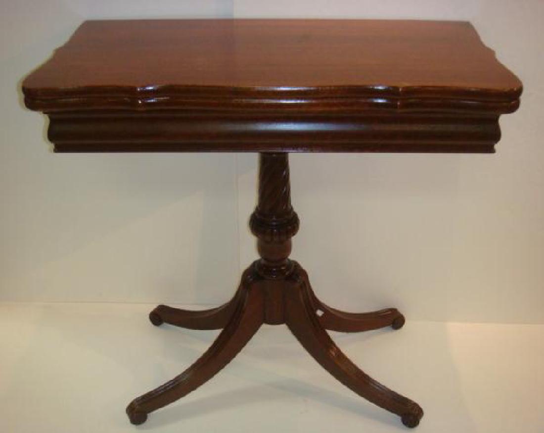 Duncan Phyfe Mahogany Fold Top Game Table:: Duncan Phyfe Mahogany Fold Top Game Table: Sculpted Top with Slightly Bowed Apron. Turned Post with 4 Way Line Carved Splayed Legs Ending in Whorl Feet. 28"T X 30"W X 31"D. (160-240)