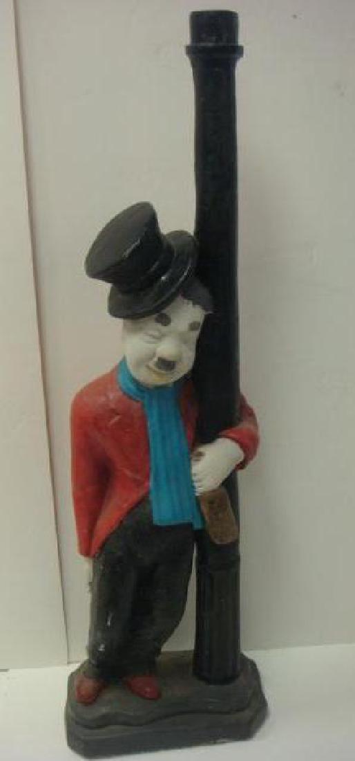 Solid Concrete Statue of Charlie Chaplin:: Solid Concrete Statue of Charlie Chaplin: The "Lamp Post Drunk" From the 1916 Film One A.M.. Hobo Hugs the Pole Holding Liquor Bottle Wearing Top Hat. Steel Reinforced Concrete. 57"T. Missing Light, S