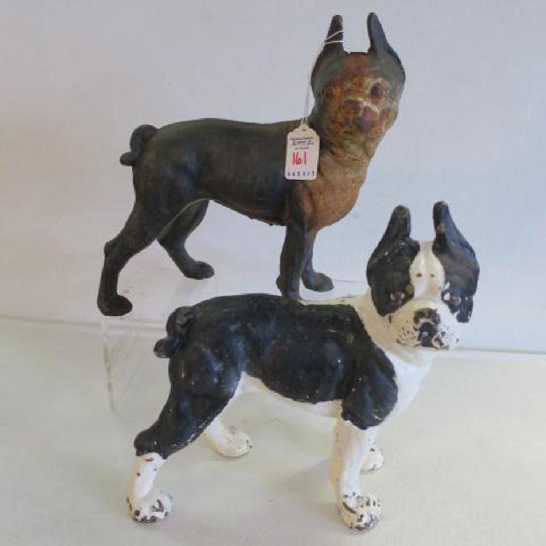 Two Cast Iron Boston Terrier Doorstops:: Two Cast Iron Boston Terrier Doorstops: Right Facing Dogs. One is Original with No Visible Seam or Screw. Black and White Paint with Some Wear. Other is a Vintage Reproduction with Rust. Both are 10"T