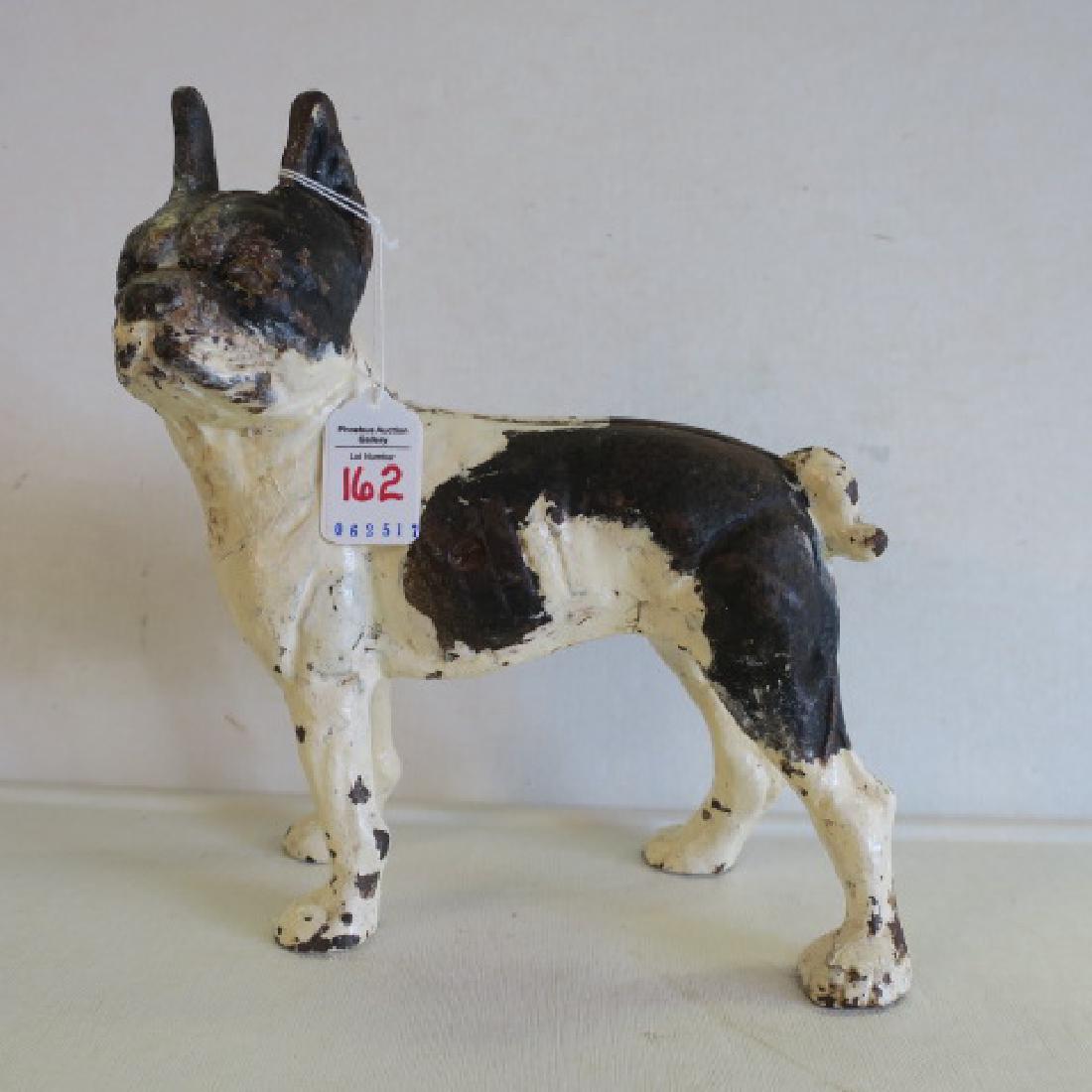 Rare Left Facing Cast Iron Boston Terrier Doorstop:: Rare Left Facing Cast Iron Boston Terrier Doorstop: Left Facing Dog has Seam and Flat Head Screw. Some Paint Loss and Wear. 9 3/4"T. (150-200)