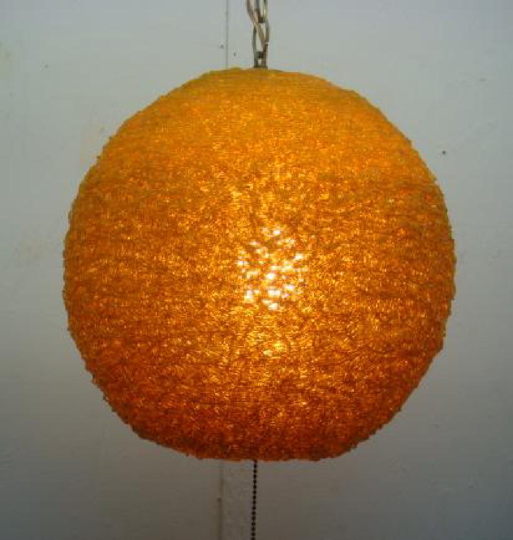 Mid Century Spun Acrylic Spaghetti Ball Shaped Light:: Mid Century Spun Acrylic Spaghetti Ball Shaped Light: Sticker Marked Portable Lamp. Amber Color with Chain Hanger. 12"D. (100-300)