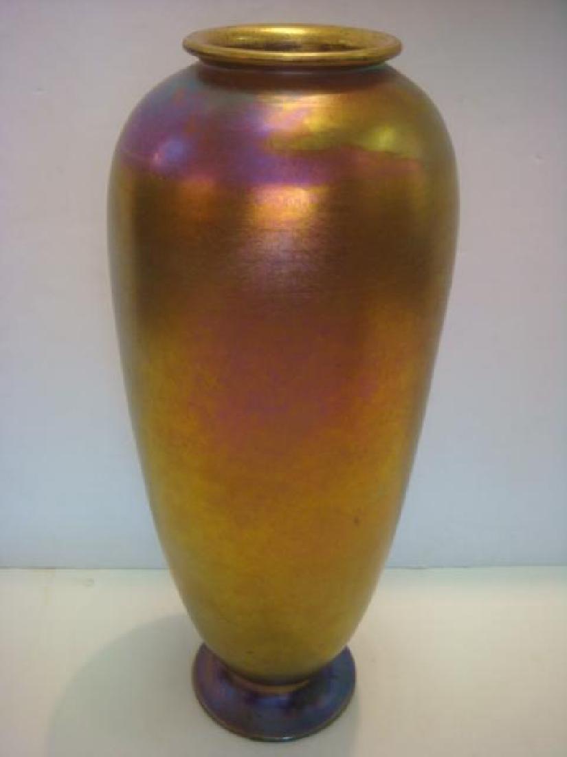 Large TIFFANY FURNACES INC Favrile Vase:: Large TIFFANY FURNACES INC Favrile Vase: CA. 1920. Glass has Gold and Rose to Purple Luster. Rough Pontil. 20 1/2"T. Has 12 3/4" Gilt Metal Insert for Flowers Protects Glass. Etched on Foot "4345 Loui
