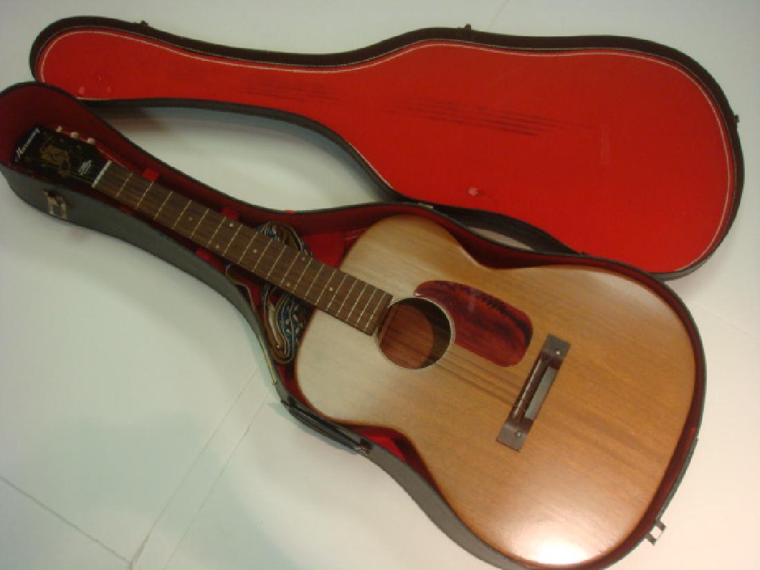 HARMONY Six String Guitar: HARMONY Six String Guitar Steel Shouldered Neck, Mahogany Body with Plastic Pick Guard. With Strap and Cardboard Carrying Case. Great Beginners Guitar. (150-300)