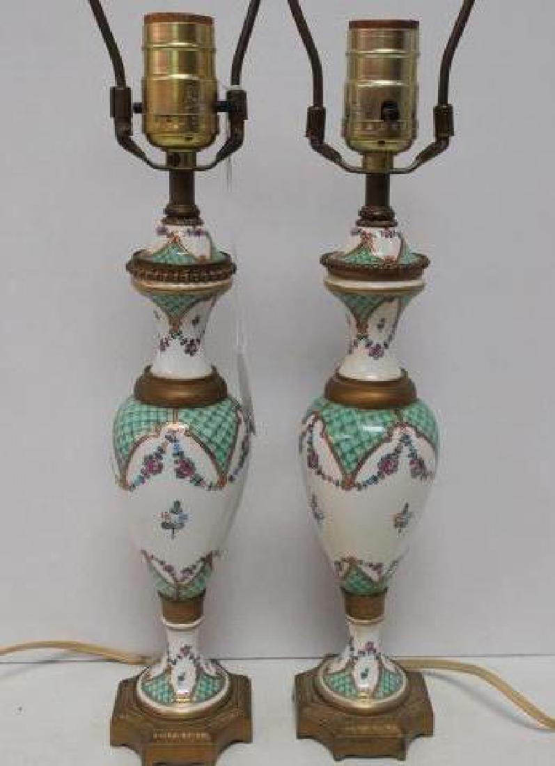 Pair of French Shaped Ceramic Boudoir Lamps:: Pair of French Shaped Ceramic Boudoir Lamps: Hand Painted Porcelain Lamps with Floral Swags and Cross Hatch Decor. Gilt Brass Feet and Rings. 18"T to Top of Harps. (200-400)